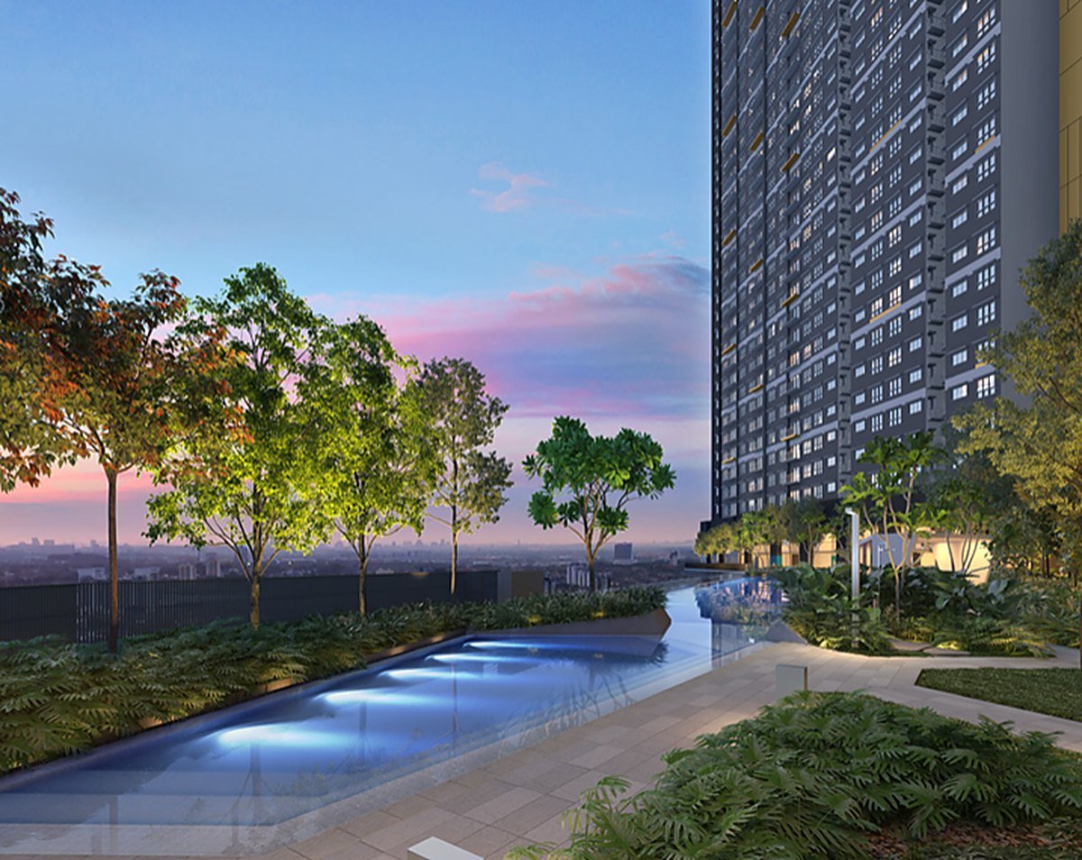 The Wyn Residences Puchong landscaped swimming pool and pool deck at dusk